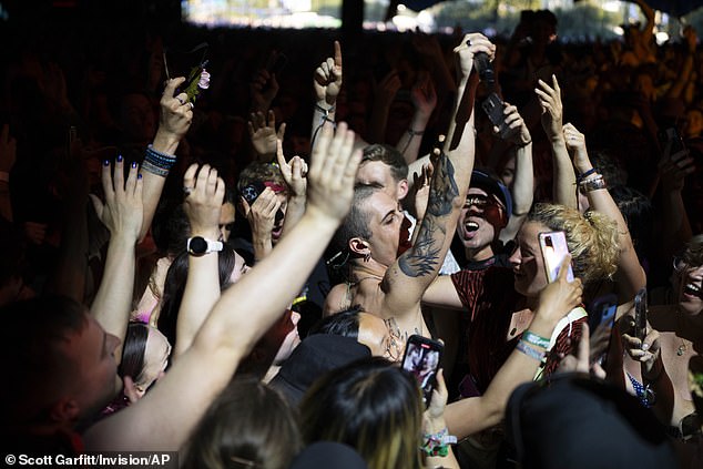 In the crowds: Singer Damiano dived into the crowds and was greeted by an array of overwhelmed fans