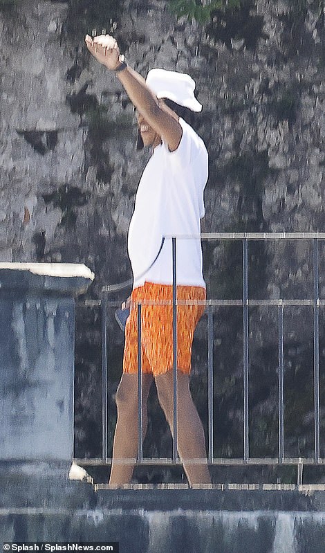 Fun: Jay Z made the most of the on-site basketball hoop before they headed on their boat trip
