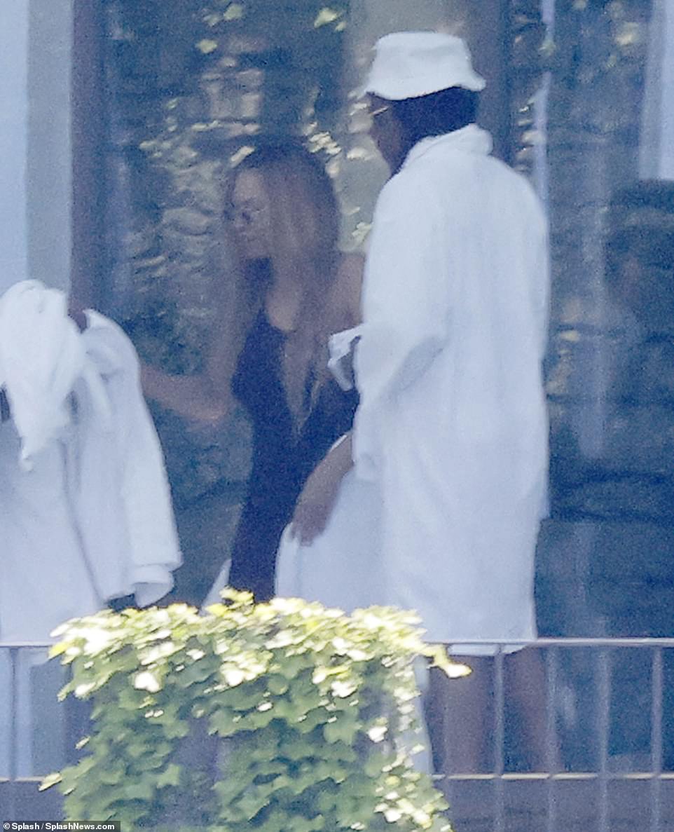 Fashionista: Beyonce showed off her stunning dress while her husband Jay Z sported a white dressing gown while relaxing on their balcony