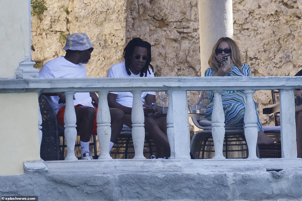 Billionaires' balcony! Beyonce and Jay Z (both pictured) - who share kids Blue Ivy, 11, and twins Rumi and Sir, five - are worth just shy of $3billion (£2.5billion) combined