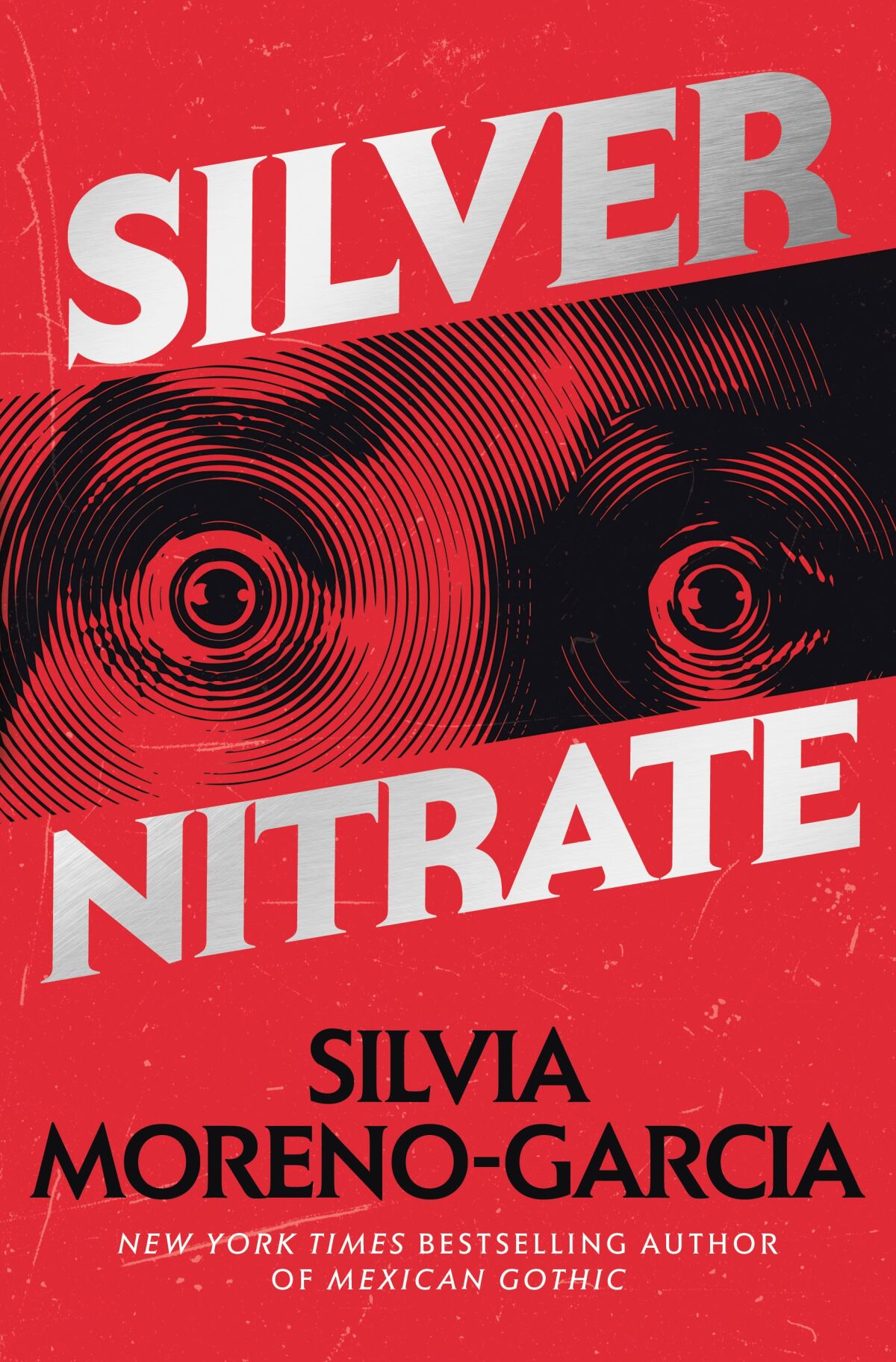 Das Buchcover zu „Silver Nitrate“ von Silvia Moreno-Garcia zeigt weit geöffnete Augen auf rotem Hintergrund