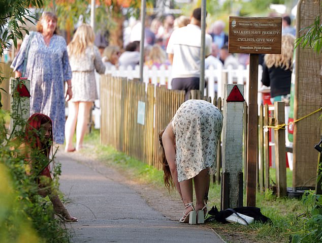 A most needed swap - a racegoer in a floral summer dress was spotted switching her heels to flats