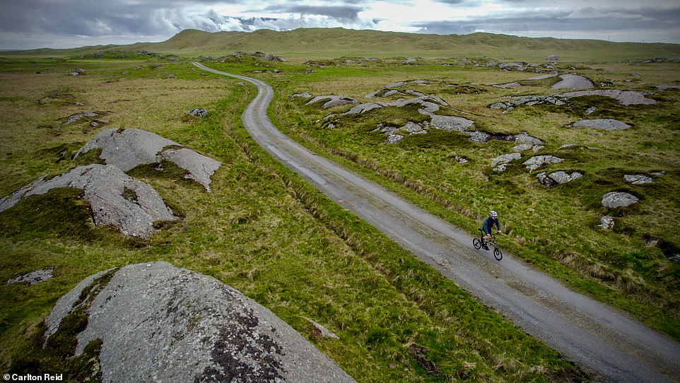 Carlton Reid explored Argyll and the Isles, a region that's marketed as Scotland's 'adventure coast'. Above, he cycles close to Breachacha Castle on the Isle of Coll