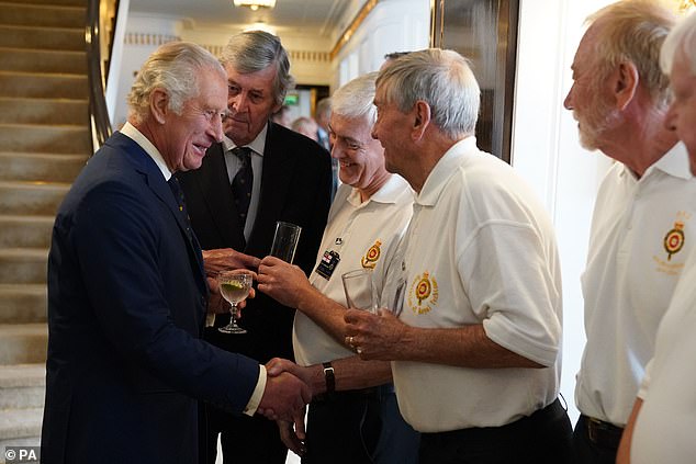 King Charles III meeting guests during a tour of the Royal Yacht Britannia, to mark 25 years since her arrival in Edinburgh