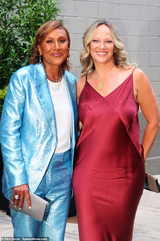 Still going strong! Also attending Gloria's wedding were Good Morning America co-anchor Robin Roberts (L) and her partner of 18 years, Plant Juice Oils co-founder Amber Laign (R)