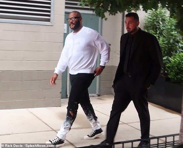 Changing first? Honorary Oscar and Emmy winner Tyler Perry - who owns his own movie/TV studio in Atlanta - was dressed far more casually for the ceremony in a sporty sweatshirt and paint-splattered ombré jeans and sneakers