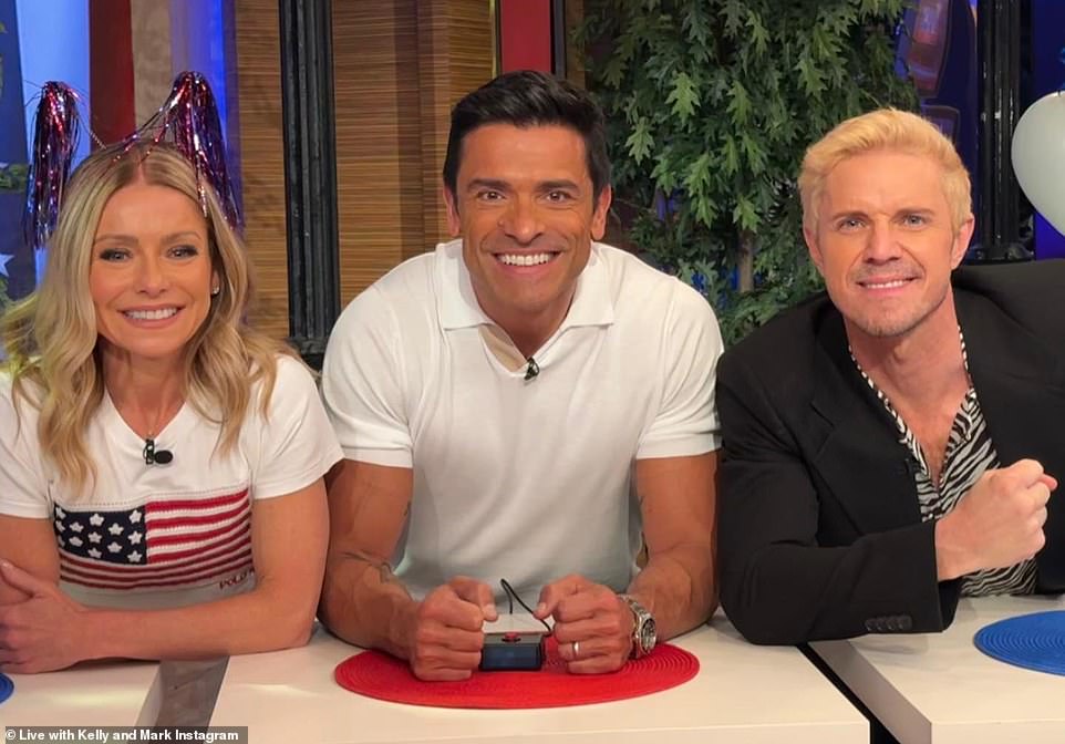 Early on Tuesday: TV hostess Kelly Ripa wore a red-white-and-blue US flag T shirt with tinsel ears as she posed with husband Mark Consuelos for their morning show
