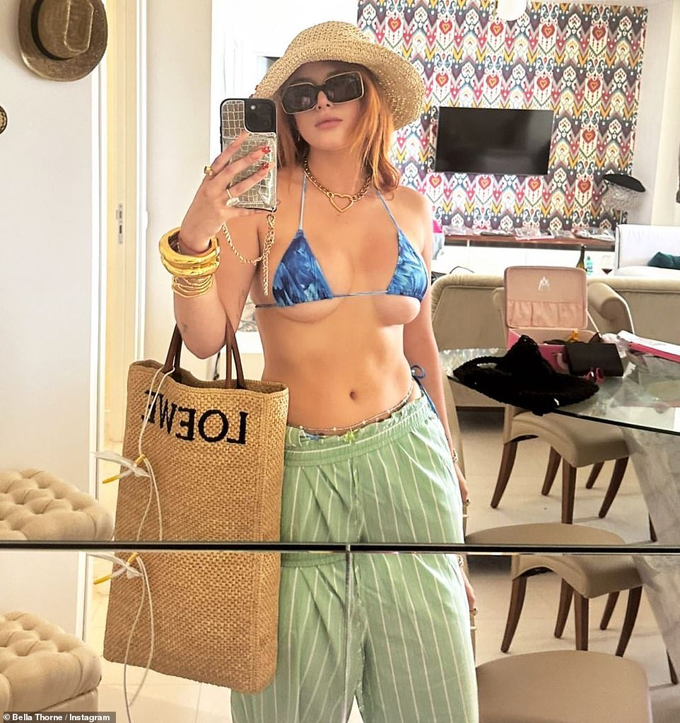 Blue suit: Bella Thorne wore a blue bikini as she took a mirror selfie on 4th Of July weekend