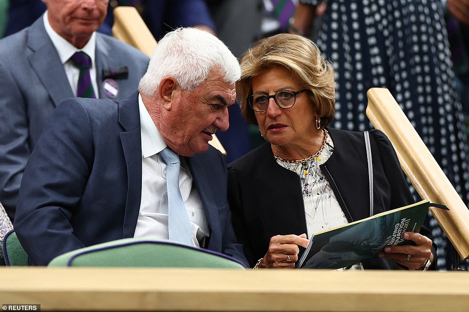 Robert and Lynette Federer, parents of Roger Federer, sit in the royal box on centre court ahead of a presentation to honour the eight-time Wimbledon champion
