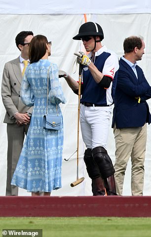 Ahead of the match, the Prince of Wales could be seen chatting with his wife the Princess (pictured)
