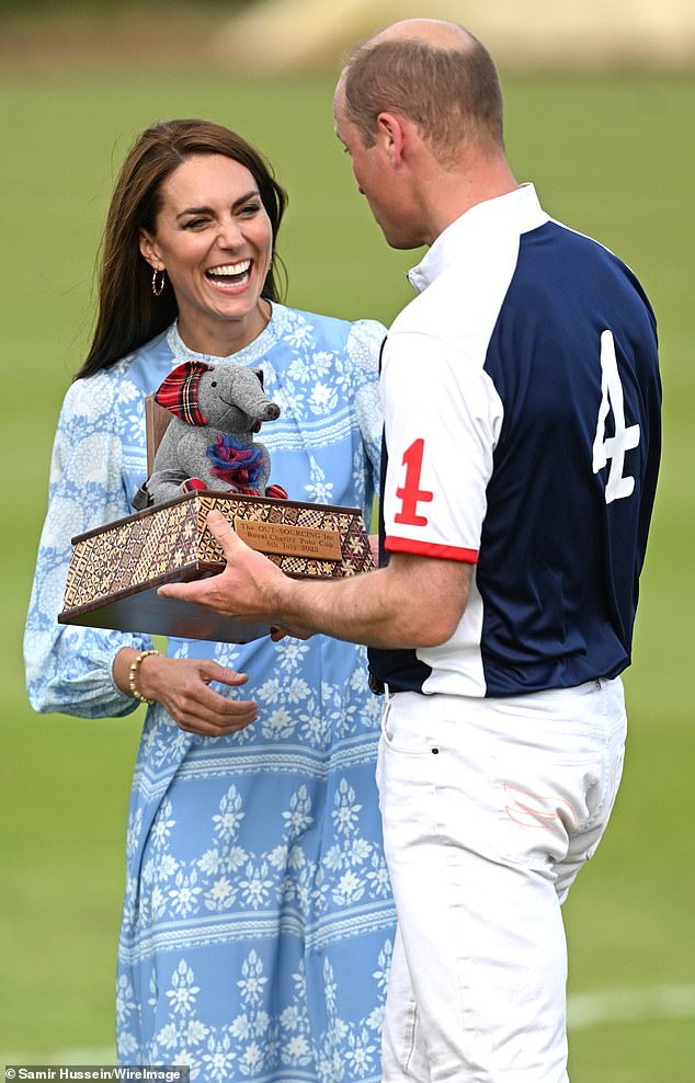 With the embrace out of the way, the couple looked much more relaxed, as Prince William showed off a trophy adorned with a cute elephant