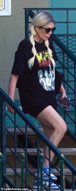 Moving on? While at the actual motel she would be seen rocking an oversized KISS graphic T-Shirt with tiny shorts