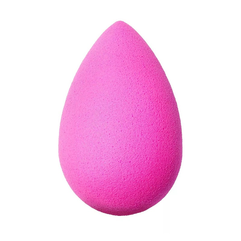 The pink, egg-shaped Beautyblender Original Makeup Sponge on a white background