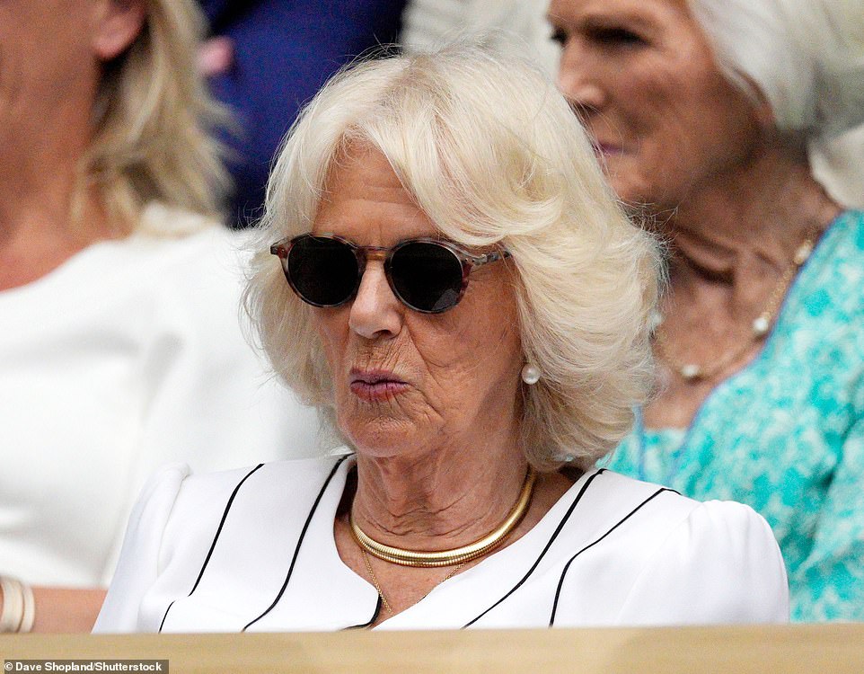 The Royal looked cool in round sunglasses, a white dress with navy piping, pearl earrings and a statement necklace