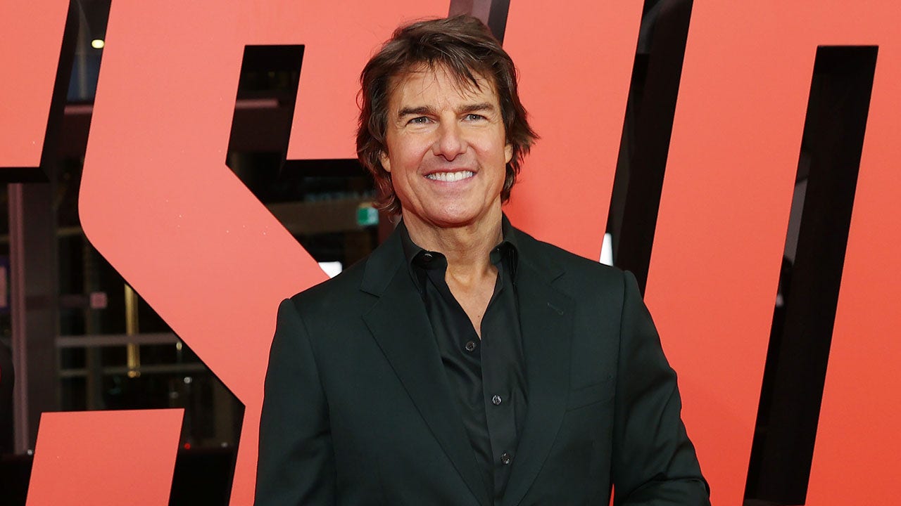 Tom Cruise smiling at movie premiere