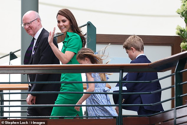 Princess Kate, 41, looked elegant in emerald as she waved at royal fans from the bridge while her children followed behind