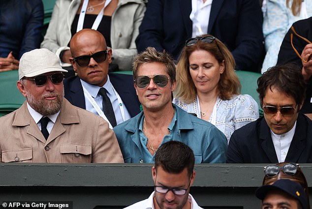 Sports fan: Brad Pitt arrived with director Guy Ritchie for the men's singles final