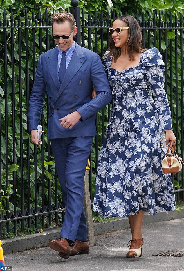 It's Love! Tom looked smart in a light blue and white striped shirt while, Zawe looked the epitome of chic in a blue floral midi dress