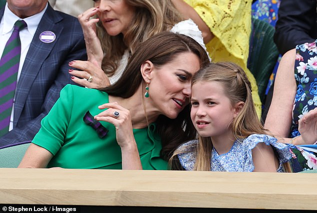Princess Kate, a keen tennis fan, explained something to her daughter Princess Charlotte as they watched the match