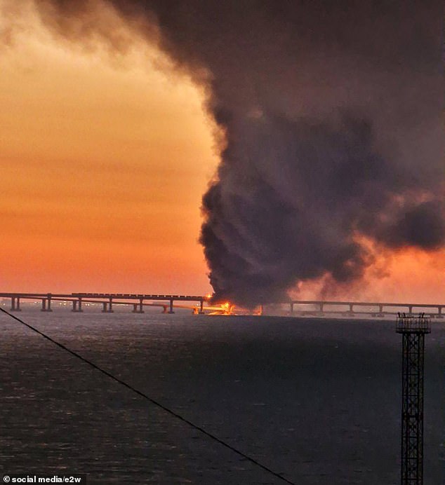 Two explosions were heard on Vladimir Putin's £3 billion 12-mile bridge, connecting annexed Crimea to Russia resulting in casualties. The same bridge was also hit in October, as pictured above