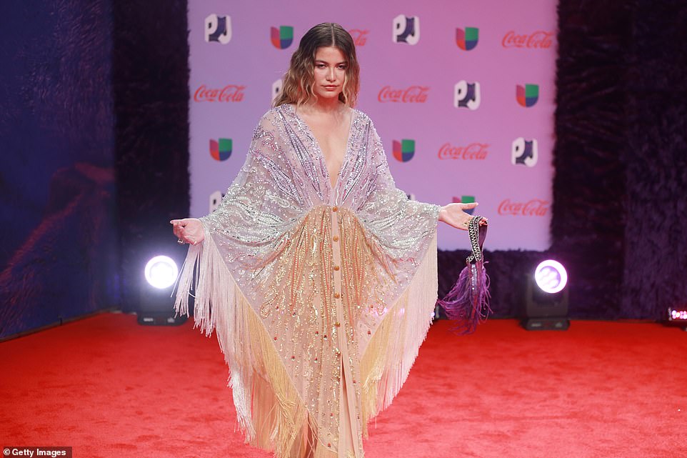 Making a statement: Other attendees included Sofia Reyes, who wore a plunging gown covered in sequins and fringe