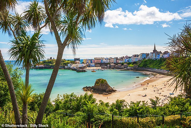 TENBY NORTH BEACH, PEMBROKESHIRE: One of the most photographed sights in Wales, Tenby North Beach is 'a superb, sheltered, sandy beach with the pinnacle of Goskar rock sticking out of the sand in the middle', as described by Visit Pembrokeshire