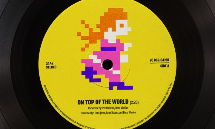 A pixelated Princess Peach appears on a vinyl record label.