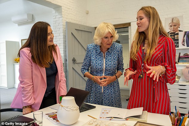Camilla appeared engrossed in conversation as she learned about the company's designs today
