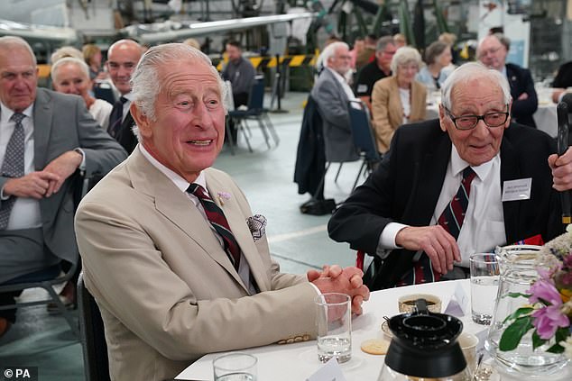 Charles pictured with veteran Burt Hammond (right) during a visit to the Battle of Britain Memorial Flight