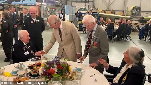 Pictured: King Charles shakes hands with veterans at RAF Coningsby in Lincolnshire this afternoon