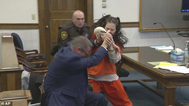 Taylor Schabusiness, 25, is seen attacking her attorney, Quinn Jolly, in court on February 14