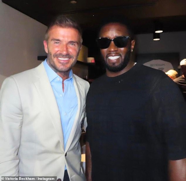 Say cheese! David also posed with rapper Diddy, also known as Sean Combs, as they socialised during the match