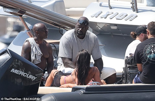 The seven-foot-one icon seized the chance to unwind on deck with friends amid his tour
