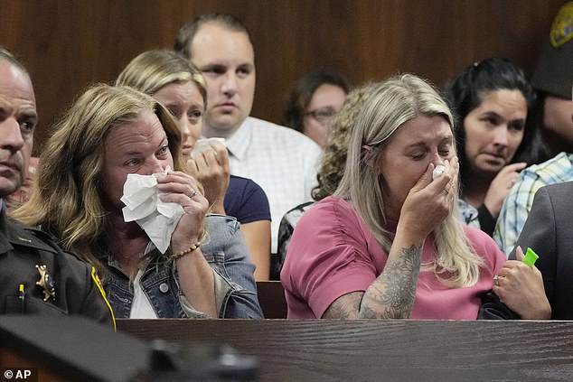 Family members react during the court hearing on Thursday in Pontiac, Michigan, as they view video of the Oxford High School shooting where Crumbley killed four students