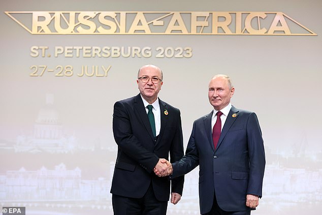 Russian President Vladimir Putin (R) and Algerian Prime Minister Ayman Ben Abderrahman (L), during the Africa summit