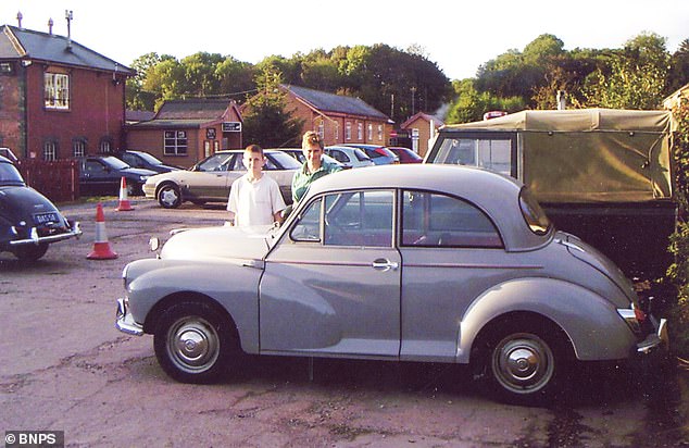 The Morris Minor on parade in 2000. Greg, now 64, has kept hold of the vehicle for 47 years, clocking up almost 200,000 miles on road trips all over Britain