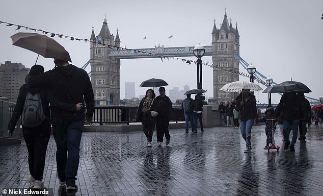 Londoners had to get their brollies out as rain swept the capital on the last day of July