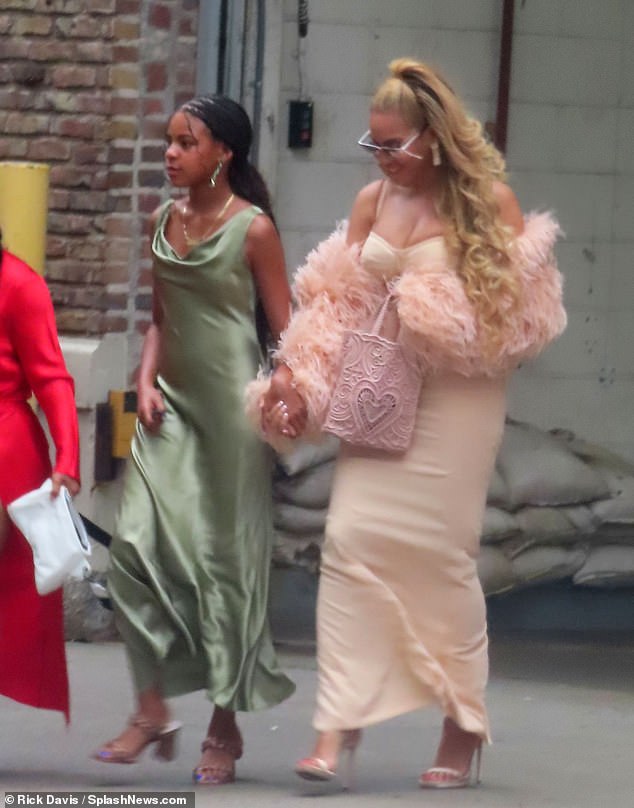 Holding hands! Beyoncé Knowles-Carter and her eldest child Blue Ivy Carter donned glamorous dresses for the lavish wedding of Jay-Z's mother Gloria Carter at Tribeca 360° in Manhattan on Sunday