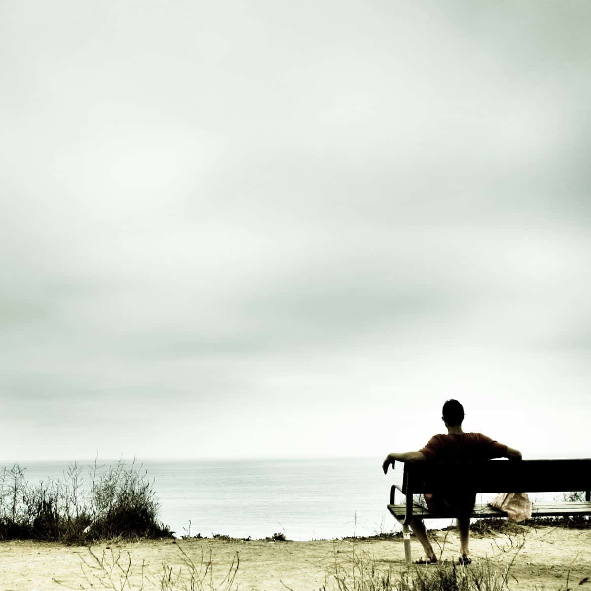 person sitting on bench.