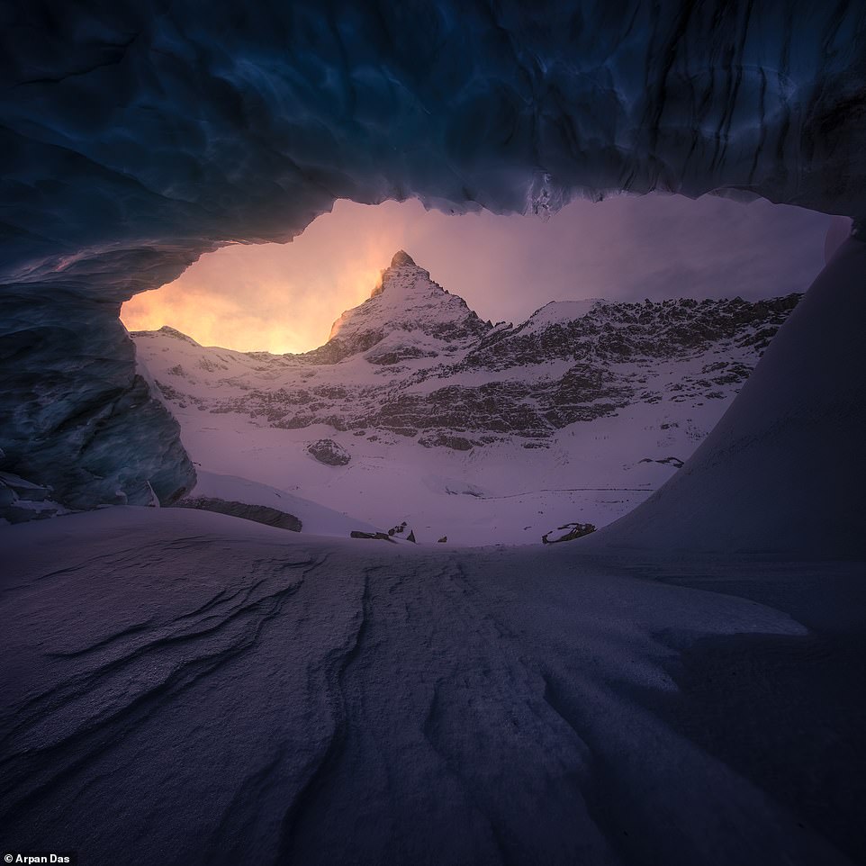 Das captured this picture of the Matterhorn, an iconic mountain on the Swiss-Italian border, from an ice cave. He says: 'I reckon there might be very few ice caves in the world with such a great mountain backdrop - and when it is Matterhorn it becomes extra special'