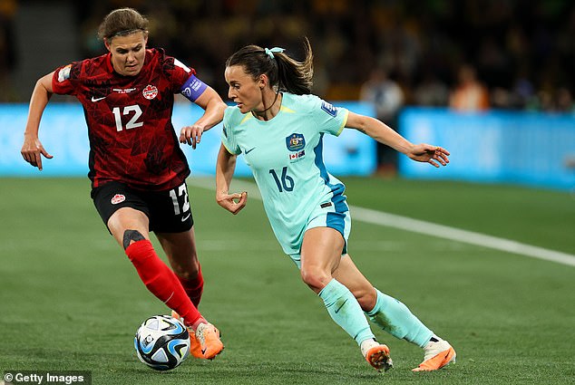 The thumping result ensured Australia topped Group B, and moved into World Cup round of 16 (Raso is pictured right, with her iconic hair ribbon)