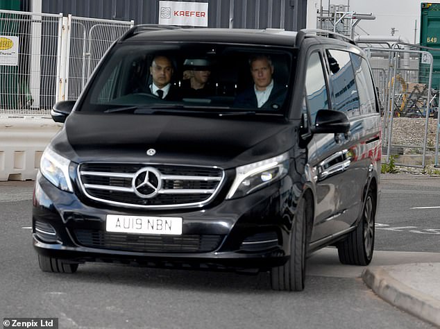 The Danish striker (back left seat) will head to United's Carrington training complex to undergo his medical