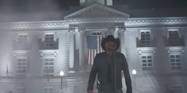 Jason Aldean sings in front of the Maury County courthouse with an American flag in his music video for "Try That In A Small Town"