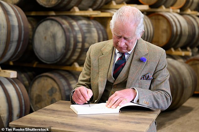 Charles signs the visitor book at 8 Doors Distillery in Wick, Scotland this afternoon