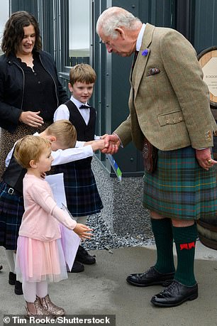 King Charles greets local schoolchildren