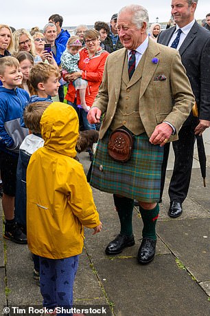 King Charles greets local schoolchildren