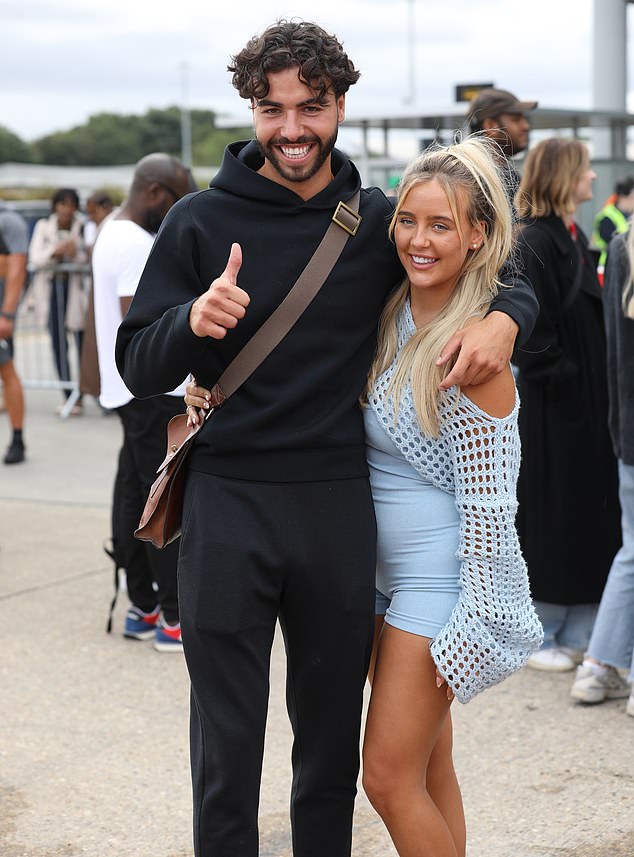 Don't mind us: The controversy surrounding Jess and Sammy's unexpected triumph was swept aside as the couple left the Spanish villa and flew home courtesy of Jet2.com
