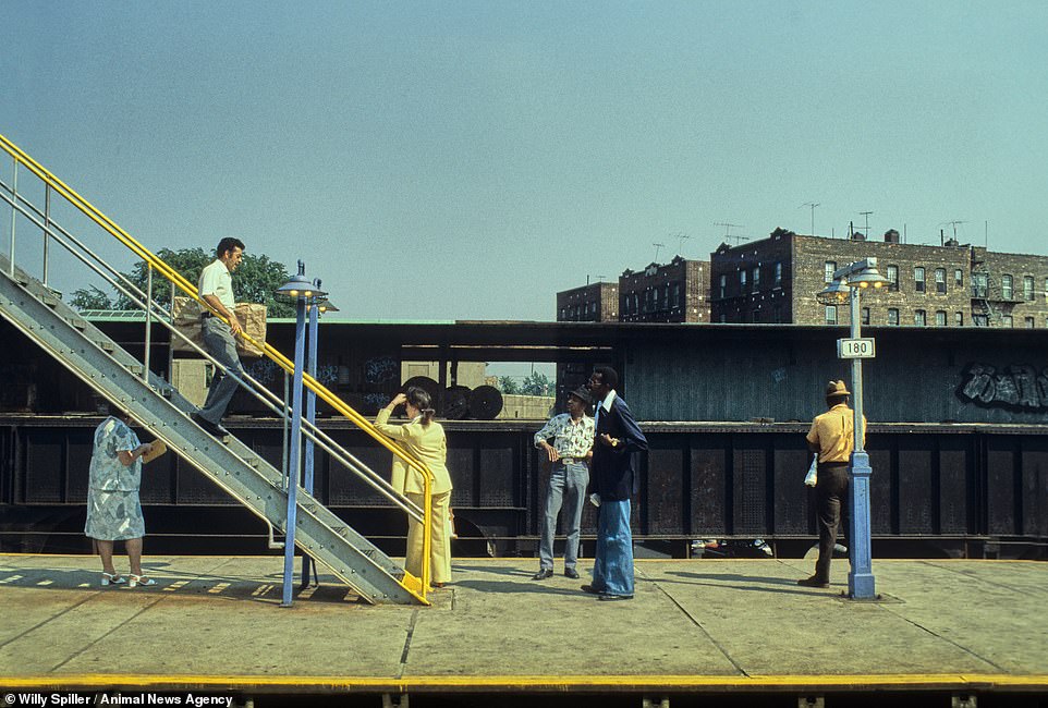 Elevated Station 180 St, Queens, New York, 1982. A man walks down the iron steps to a platform overlooking residential buildings. Spiller's book, Hell On Wheels, has recently been republished as a special edition