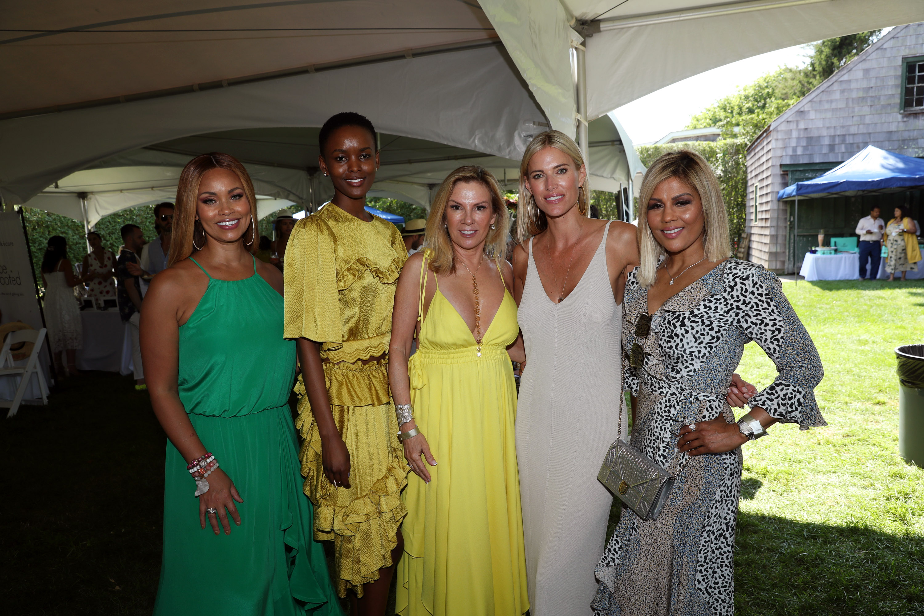 Ramona Singer, Kristen Taekman and more guests hanging out at a Hamptons party