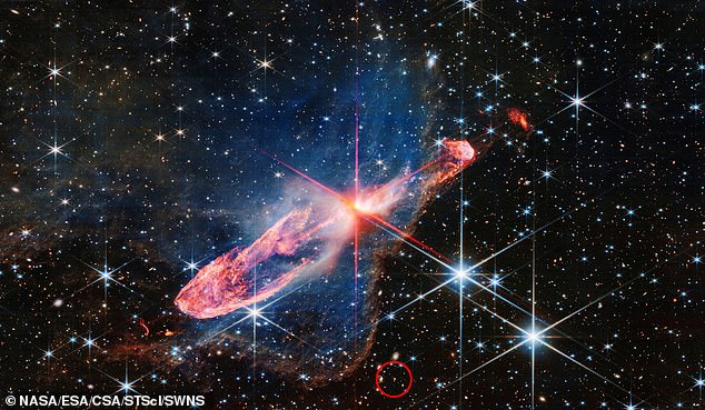 The question mark was revealed in the outer part an image by Webb (circled), which is the largest and most powerful telescope ever launched into space, and can see galaxies which existed only a few hundred million years after the Big Bang